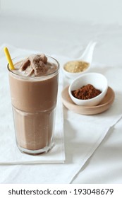 A Glass Of Chocolate Smoothies On White Fabric