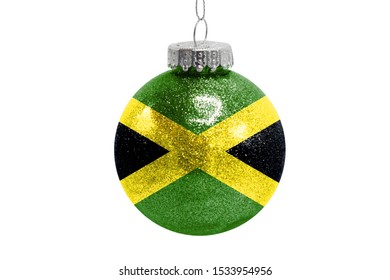 Glass Christmas ball toy isolated on white background with the flag of Jamaica