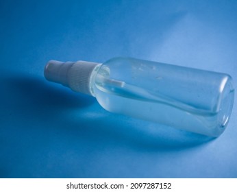 Glass Cleaning Bottle On Colored Background.