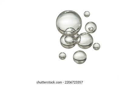 Glass clear water bubbles isolated over white.