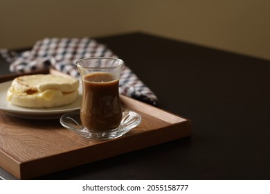 Glass Of Coffee And Cheese In English Muffin On The Table