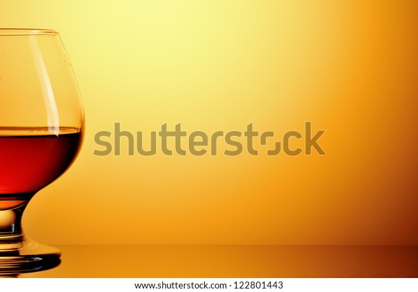 Download Glass Cognac On Yellow Background Stock Photo Edit Now 122801443 Yellowimages Mockups