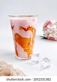 A glass of cold 'air bandung' meaning rose syrup mixed with condensed milk to produce pink color. It is traditional drink and famous in Malaysia,  Brunei, Singapore and Indonesia.