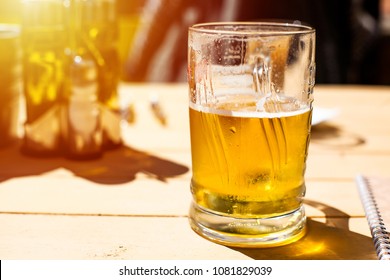 Glass Of Cold Beer Outside On A Table