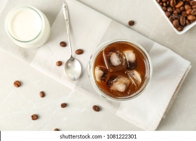 Glass With Cold Brew Coffee And Beans On Light Background, Top View