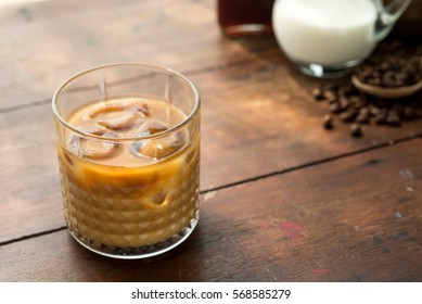 glass of cold brew iced coffee with milk
