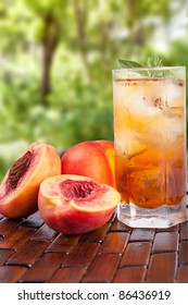 Glass of cold fresh tea with peach