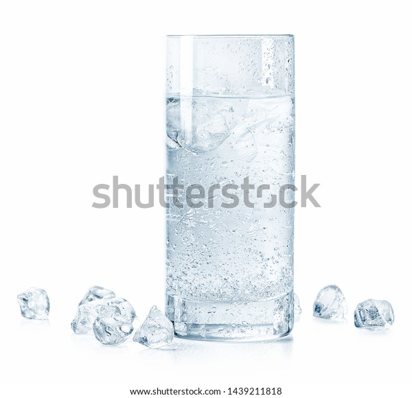 Glass of cold sparkling water and ice isolated on white background