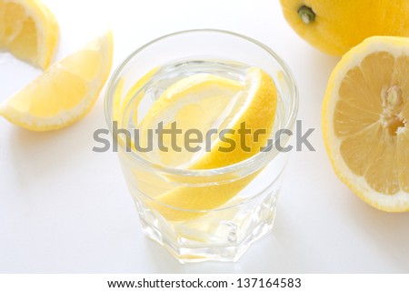 Glass of cold water with lemon slices