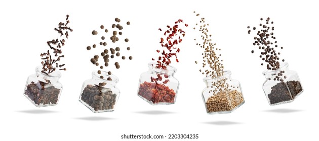 Glass container with falling spices. A burst of spices. Different types of spices - Powered by Shutterstock