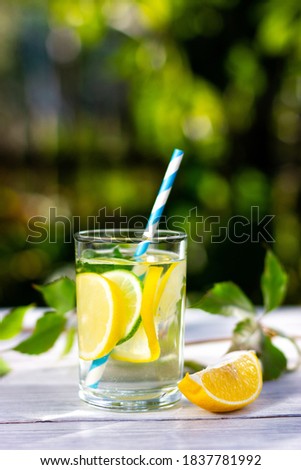 Similar – Infused fruit water cocktails and woman drinking green smoothie