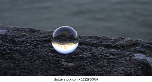 A Glass Crystal Ball With Castle Inside