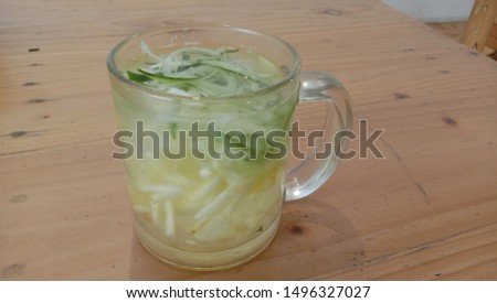 a glass of cucumber ice, a vegetarian drink