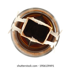 Glass Cup With Drip Coffee Bag Isolated On White, Top View