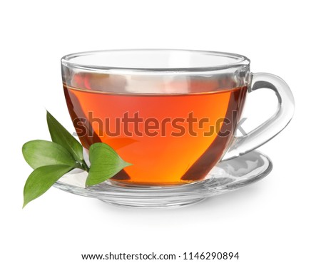 Glass cup of hot aromatic tea on white background