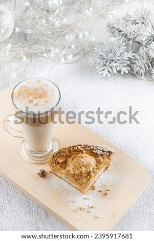 Glass cup of layered latte Coffee with apple pie. for Christmas breakfast. concept Christmas Holiday. selective focus. Holiday XMas composition decorations
