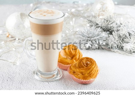 Glass cup of layered latte Coffee with delicious buns for Christmas breakfast. concept Christmas Holiday. selective focus. Holiday XMas composition decorations
