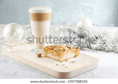 Glass cup of layered latte Coffee with apple pie. for Christmas breakfast. concept Christmas Holiday. selective focus. Holiday XMas composition decorations. Place for text, Copy paste.