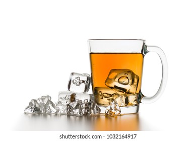 Glass Cup Of Tea With Ice Cubes On White Table.