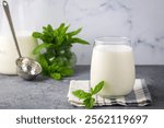 Glass cup of Turkish traditional drink ayran , kefir or buttermilk made from yogurt, healthy food