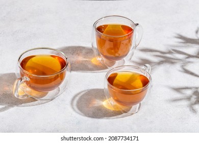 glass cups of tea on lightn table 