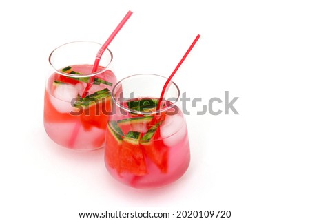 Glass cups with watermelon nectar.