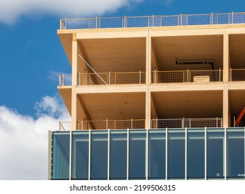 Glass Curtain Wall Being Installed On An Mass Laminated Timber Multi Story Green, Sustainable, Residential High Rise Apartment Building Construction Project