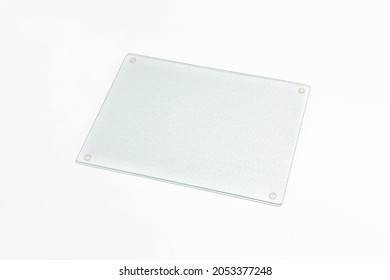 Glass cutting board isolated on white background. High-resolution photo.Mock-up