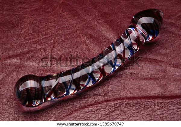 Glass Dildo On Red Leather Stock Photo Edit Now 1385670749