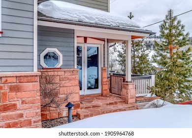 Glass Door Entrance Of Home In The Mountain Neighborhood With Snow In Winter