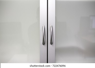 Glass Door With Metal And Aluminum Handles Close Up