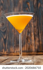 Glass Of Downhill Racer Cocktail On Wooden Background