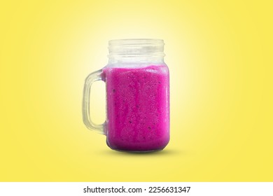 A glass of dragon fruit smoothie. Fresh juice on a yellow background - Shutterstock ID 2256631347