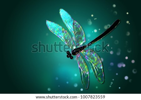 Glass dragonfly with effect of holography  on a green background with patches of light

