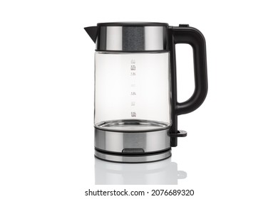 Glass, Electric, Modern Transparent Kettle On A White Background. Close-up. With A Reflex On The Table