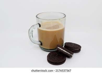 A Glass Of Espresso Cup And Oreo Cookies Cake With White Background