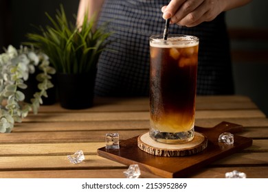 Glass Of Espresso With Lemon Juice On Wooden Table And Copy Space, Summer Cocktail, Cold Brew Coffee Or Black Tea. (close Up, Selective Focus)