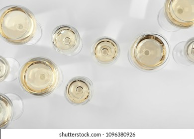 Glass Of Expensive White Wine On Light Background, Top View