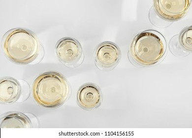 Glass Of Expensive White Wine On Light Background, Top View