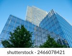 Glass facades of tall office buildings, blue sky