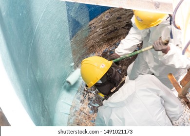 glass fiber material prepare for lining coating repair. scrub waste water tank repair