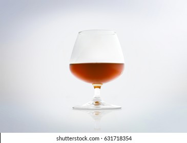 Glass of a french cognac brandy. Isolated on white background.