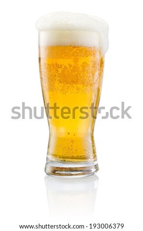 Glass of fresh beer with cap of foam isolated on white background