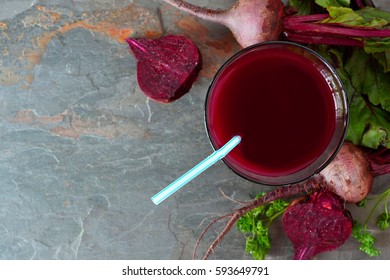 Glass Of Fresh Beet Juice, Downward Scene Over A Dark Slate Background