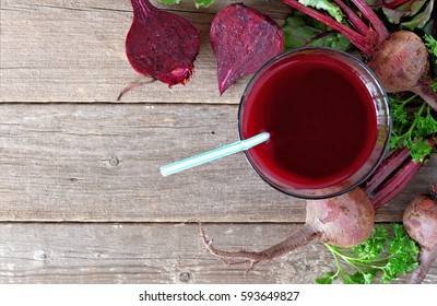 Glass Of Fresh Beet Juice, Downward Scene Over A Rustic Wood Background