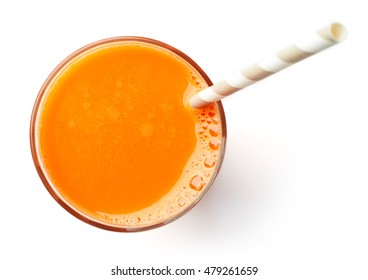 glass of fresh carrot juice isolated on white background, top view