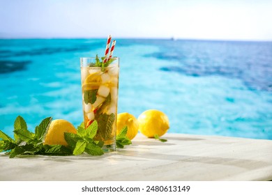 Glass of fresh cocktail on wooden board  background. Cold icy lemonade in hot summer. Copy space on wooden table. - Powered by Shutterstock