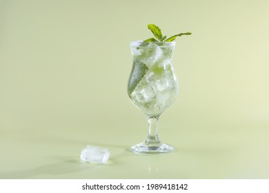 A Glass Of Fresh Seltzer Water With Ice Cubes And Mint. The Freshness Of A Hot Summer