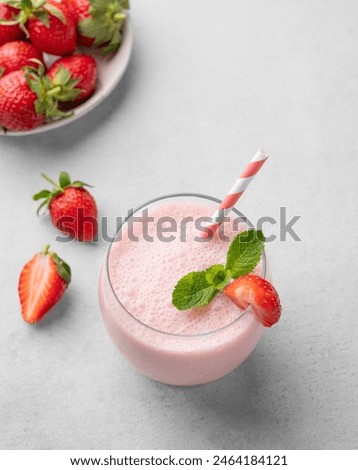 Similar – Image, Stock Photo Strawberry milkshake topped with whipped cream, minimalist on a green background