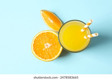 Glass of freshly squeezed orange juice on color background  - Powered by Shutterstock